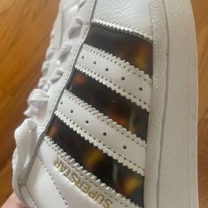 Superstar Adidas never worn shoes. Size 8. Tortoise accents. New with tags